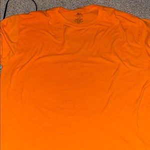 a orange shirt.